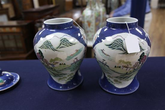 A pair of Chinese famille rose powder blue ground jars and covers, Kangxi marks, early 20th century, height 31.5cm